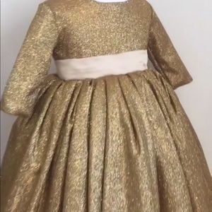 Gold dress with pink bow